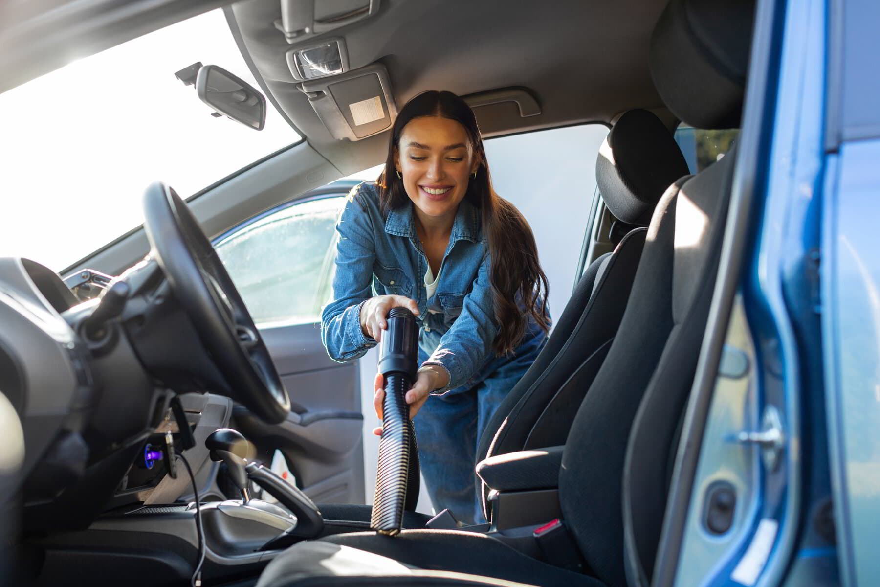 Customer at a Popular Car Wash location — interior detailing in progress